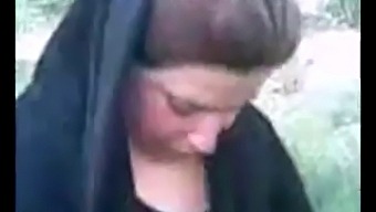 Hijab-Wearing Arab Woman Engages In Outdoor Sexual Activity
